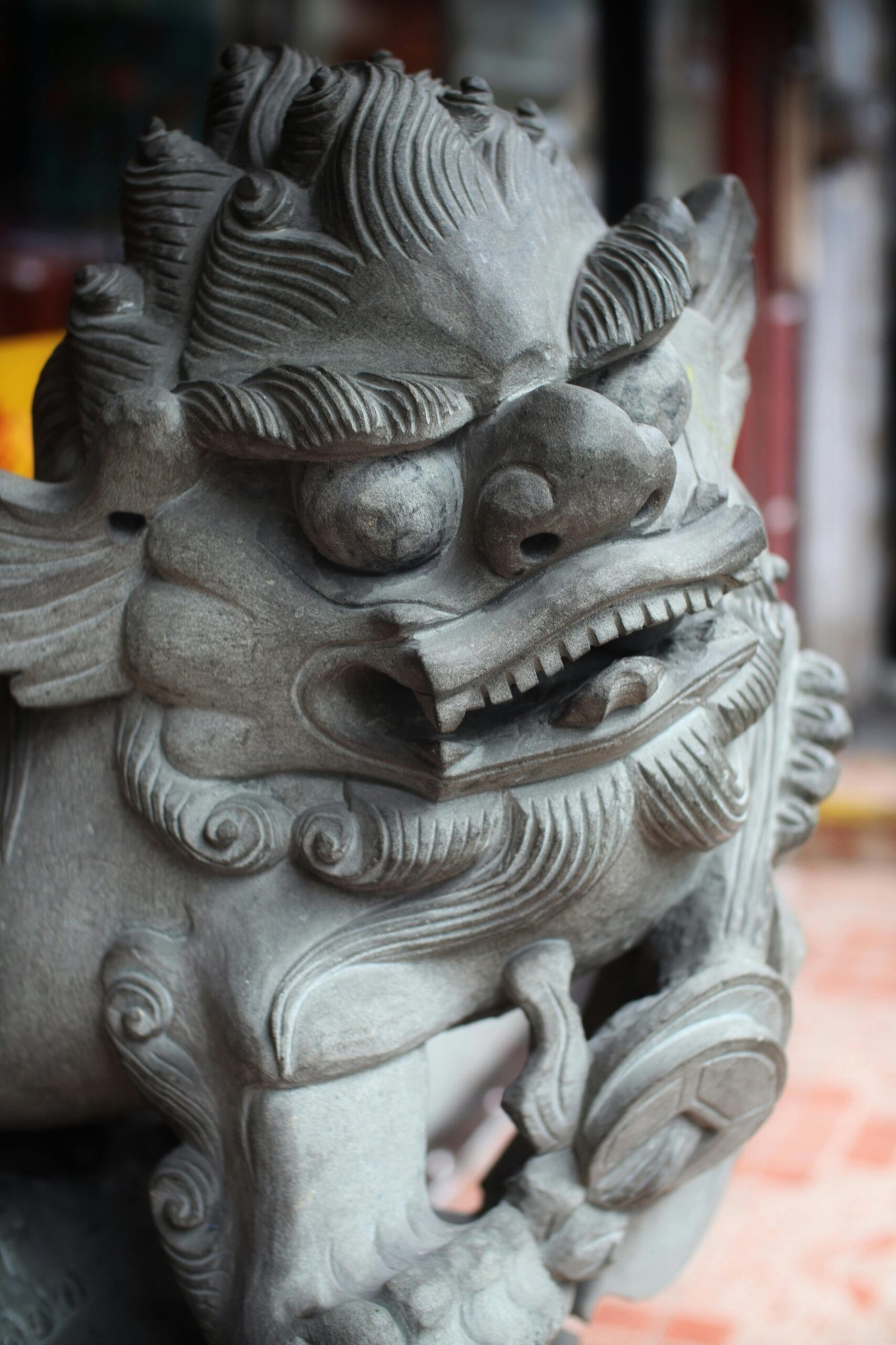 Dog Myths and Tales Dog Myths and Tales: Close-up of a traditional Japanese lion dog sculpture showcasing intricate stone carvings, embodying cultural artistry.